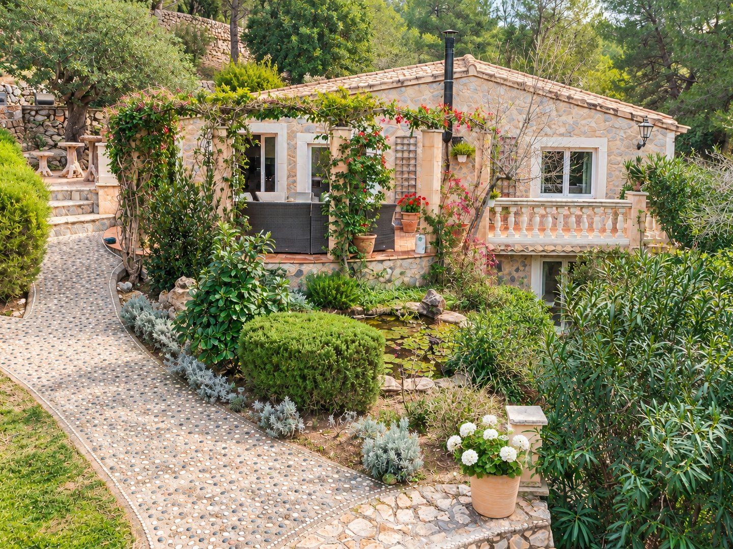 The stone house above the garden path