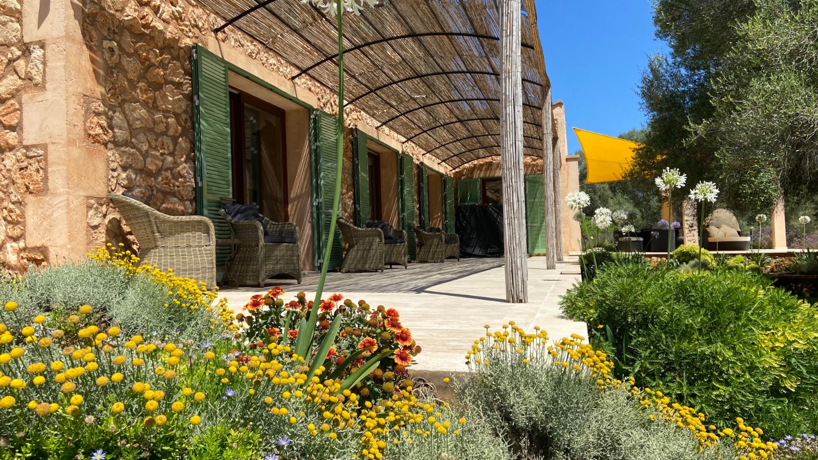 Covered terrace and flower garden